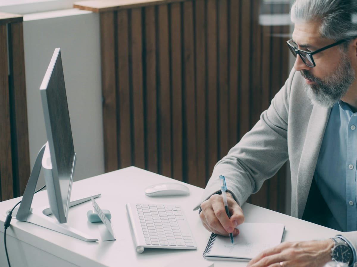 Business owner working through an application at a computer