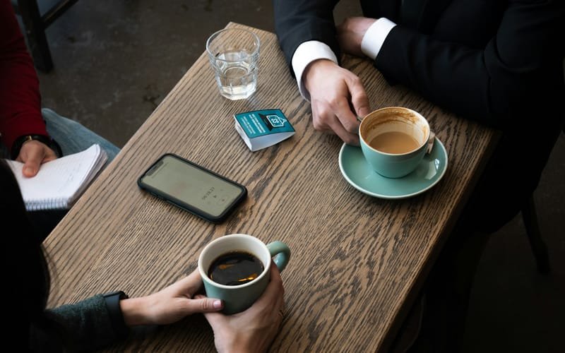 Two people starting a conversation over coffee