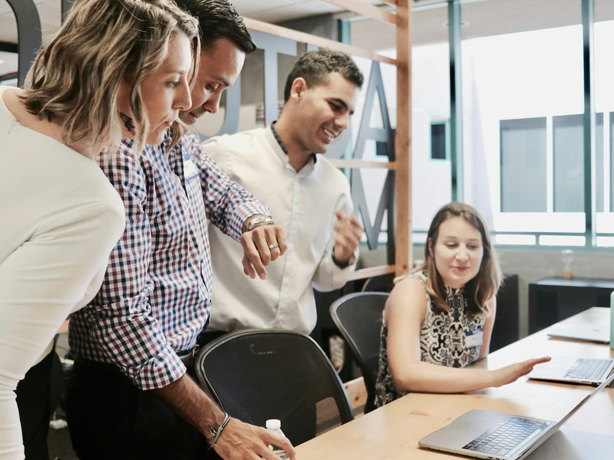 Team working through a business plan together at a desk